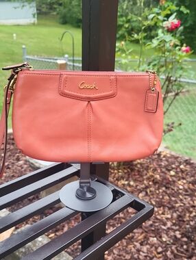 Coach Coral-Orange Leather Wristlet with Gold Logo